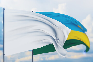 White flag on flagpole waving in the wind and flag of Rwanda. Closeup view, 3D illustration.