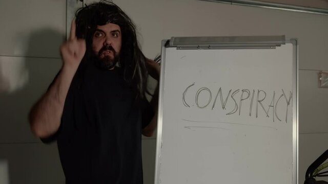 crazy conspiracy guy with whiteboard