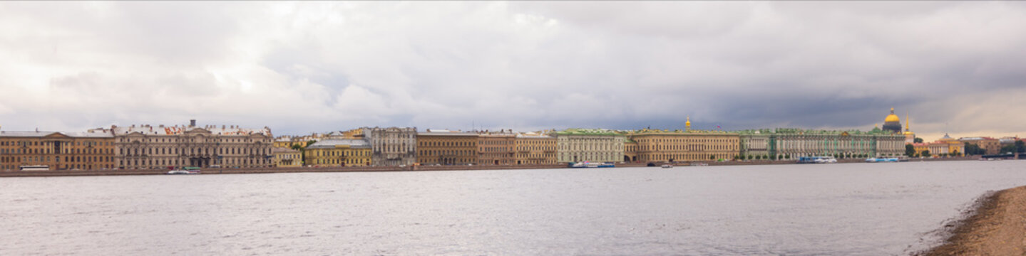 Panoramic view of the banks of the Neva River from the side of the Peter and Paul Fortress in St. Petersburg, Russia