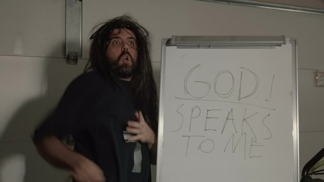 crazy religous guy in garage