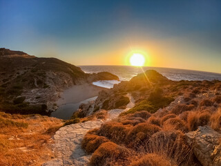 Magical path down to the Nas beach in Ikaria while sunset with red color