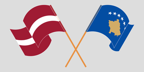 Crossed and waving flags of Kosovo and Latvia