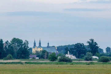Panorama of the city of Kolo - monastery and town hall from the side of the Warta River - Poland
