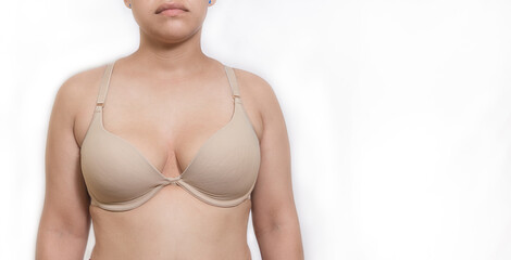 Latin woman in bra with a white background to use in October breast cancer awareness month BCAM 
