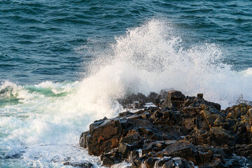 Waves crashing on rocks at Kullaberg nature reserve in south Sweden.