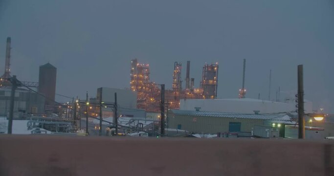 Montreal, Canada - November 15th 2017 : Montreal East Oil Refinery of Shell Canada, filmed while driving on Metropolitan highway during a winter evening.