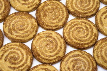 Round cookies sprinkled with sugar. Round cookies. Curled cookies with sugar.
