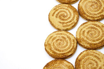 Round cookies. Curled cookies with sugar. Round cookies sprinkled with sugar.