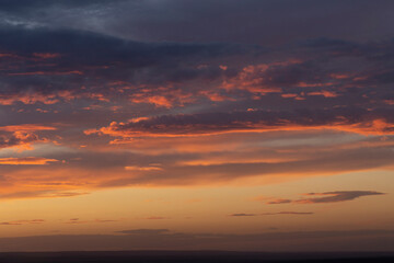 Purple-magenta clouds. Tragic gloomy sky. Landscape with bloody sunset. Fantastic skies on the planet earth. Twilight, nightfall. Blackout.