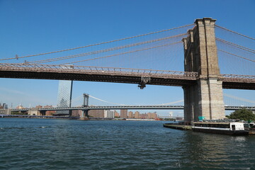 A view of the Brooklyn Bridge from the East River in New York City.