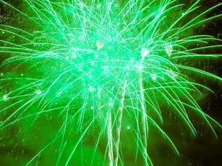 Green Burst. Firework Display Nottingham Riverside Festival. Full frame green explosion.