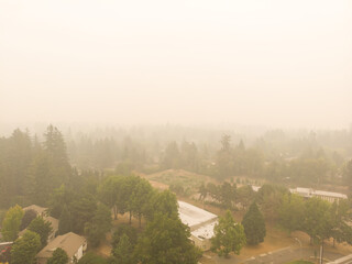 Beaverton Oregon city in smoke, behind burning forests, top view, news