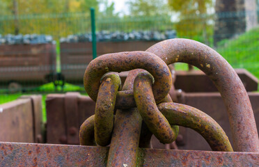 A heavy steel chain on abandoned ore cart.