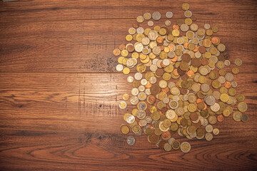 Coins from different countries. Pile of Golden, silver, copper, quarters, nickels, dimes, pennies,...
