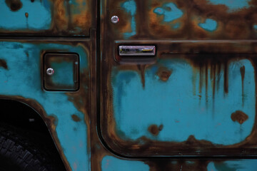 The versatile off-road car door or Sport Utility Vehicle / SUV is modified with paint like rust to give the impression of being more classic