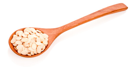 watermelon seeds in wooden spoon isolated on white background.