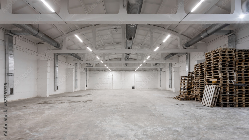 Wall mural industrial building interior with white brick walls, concrete floor and empty space for product disp