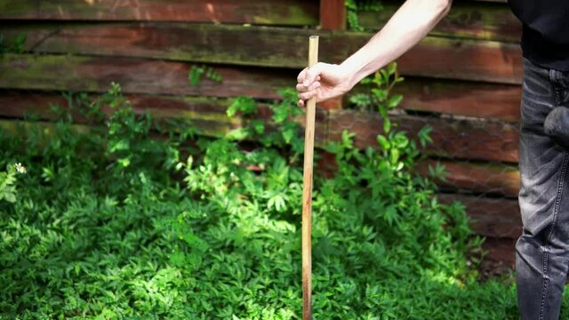 Man Hammering Wooden Stake Into Ground 4k