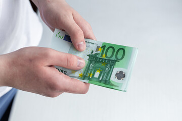 Man hands counting euro banknotes. Finance and business concept. Selective focus. Close-up