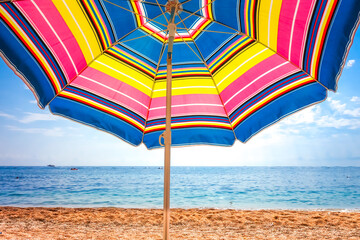 Colorful umbrella close-up on a tropical beach