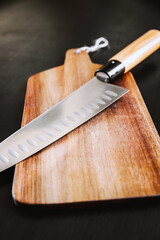 Traditional Japanese gyuto knife on a cutting board