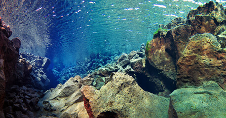 rocky slope underwater in glacial spring iceland