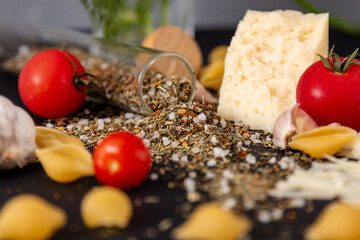 pasta shells cheese spices with red tomatoes