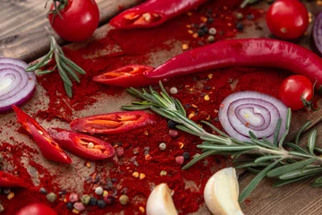 Fotobehang spices onion red pepper garlic on wood board © Александра Камболина