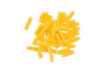 Uncooked fusilli pasta isolated on white background. Top view