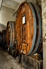 wine barrels in a cellar