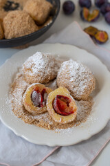 Typical Austrian plum dumplings made of leavened dough and fresh plums
