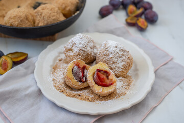 Typical Austrian plum dumplings made of leavened dough and fresh plums
