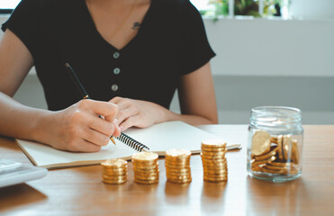 Businessman are taking notes at work to summarize business proposals, financial success, certified accounting concepts