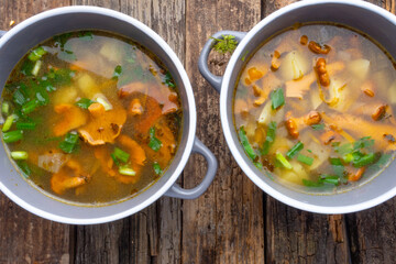 soup with chanterelles and herbs in two bowls