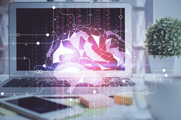Double exposure of work space with computer and human brain drawing hologram. Brainstorm concept.