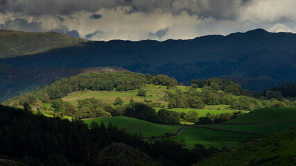 The Sun setting cast long shadows over Blea Marsh a small area of the Lake District