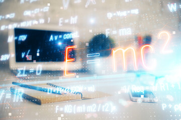 Desktop computer background and formula hologram writing. Double exposure. Education concept.