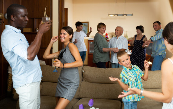 Adults and children dancing at a party at home. High quality photo