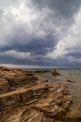 Fototapeta na wymiar Dramatic storm clouds and rain over the Adriatic Sea in summer