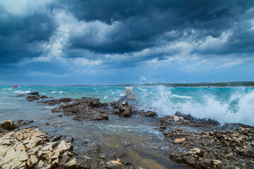 Obraz premium Dramatic storm clouds and rain over the Adriatic Sea in summer