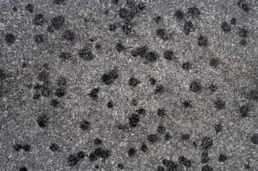 Abstract background of grey tiled walkway in a park