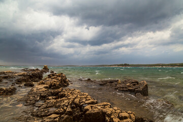 Fototapeta na wymiar Dramatic storm clouds and rain over the Adriatic Sea in summer