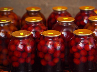 Preservation for the winter is in the pantry or cellar.Large glass jars with home preservation of...