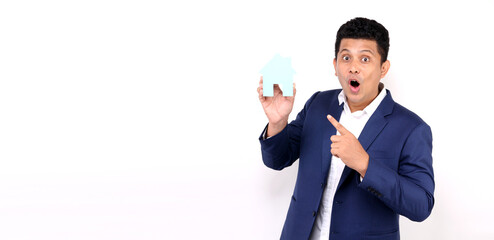  Business Asian man holding paper home shape presenting isolated on white background in studio With copy space for real estate concept.