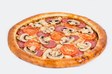 Ready-made pizza with sausage and mushrooms shot close-up