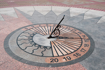 Fototapeta na wymiar Conceptual sundial in the park 