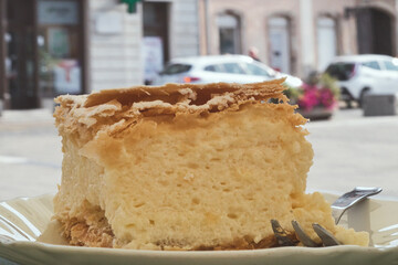 A cremeschnitte or krempita, kremšnita is a custard and chantilly cream cake dessert popular in...