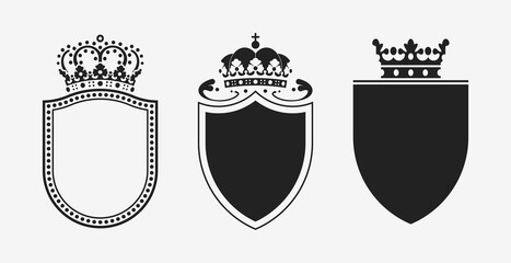 Set of crowns with shields. Black heraldic decoration vector elements.