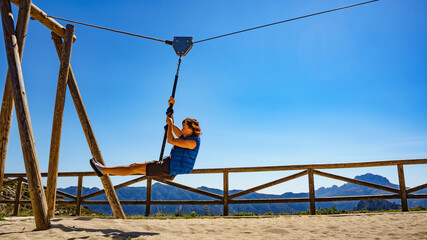 Adult woman having fun on zipline