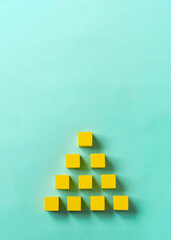 Business material, pyramid-shaped block. Society, organization, strategy, top-down, plans, ideas,...
